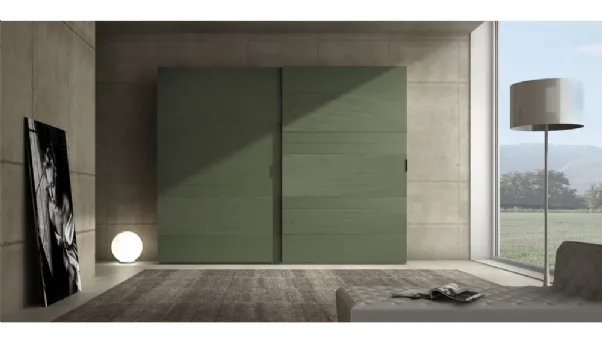 Armadio laccato opaco verde prussia con inserti in cemento Comp 06 di Voltan